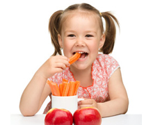 child eating carrots