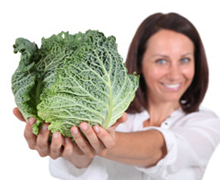 woman holding cabbage
