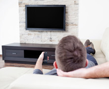 man sitting on couch man sitting on couch